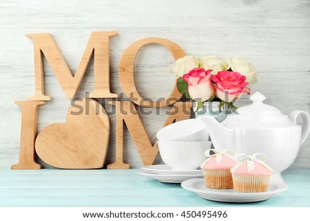 Mother's day decorations on light wooden background