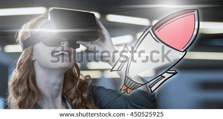Rocket against smiling businesswoman using virtual reality simulator