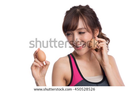 Woman with egg isolated on white background