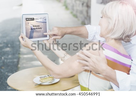 Composite image of build website interface against couple taking a selfie