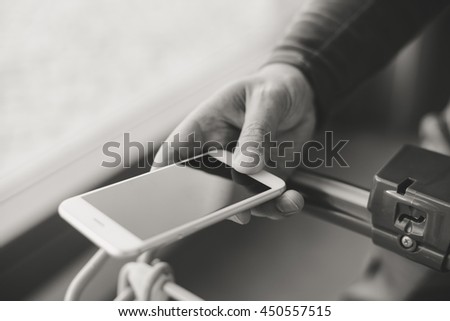 Closeup on e shopping with smart phone in human hand