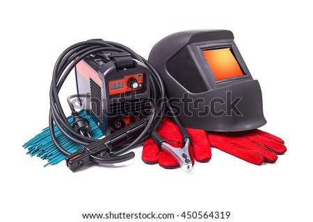 Inverter welding machine, welding equipment, isolated on a white background, welding mask, leather gloves, welding electrodes, high-voltage wires with clips, set of accessories for arc welding. Royalty-Free Stock Photo #450564319