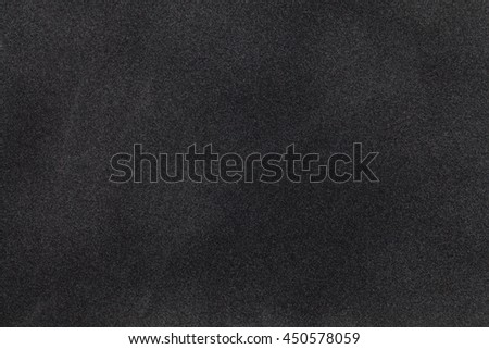 Black suede fabric closeup. Velvet texture background Royalty-Free Stock Photo #450578059
