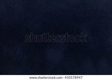 Dark blue suede fabric closeup. Velvet texture background