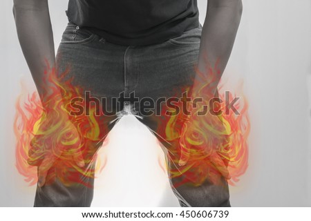 Man knee and leg painful.Concept photo with Color Enhanced pale skin with Fire indicating location of the pain.
