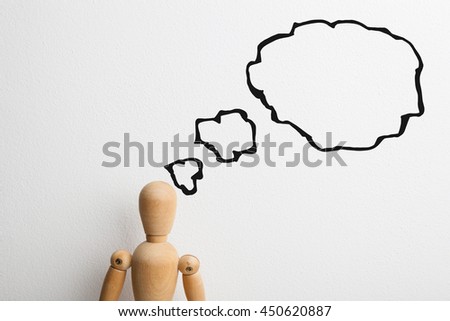 Concept of a thinking wooden dummy, business idea