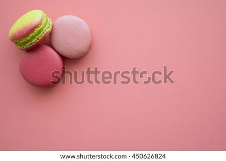Colorful france macarons on pink background