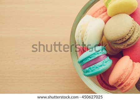 Colorful france macarons on wood table background - Retro filter effect & selective focus