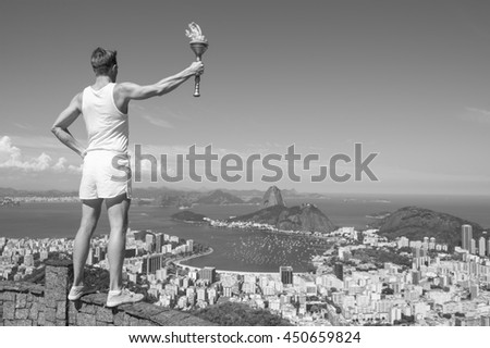 Old-fashioned torchbearer athlete in classic vintage white sports uniform standing holding sport torch at black and white city skyline overlook in Rio de Janeiro, Brazil 
