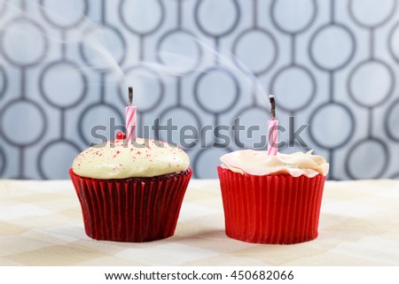Cupcake on table with candle for birthday or holidays background