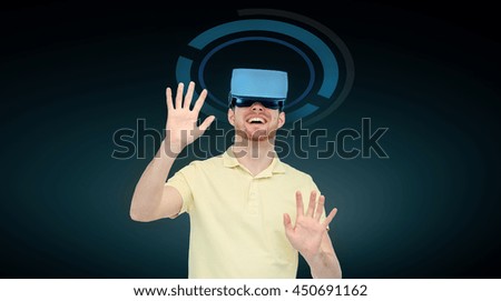 3d technology, virtual reality, cyberspace, entertainment and people concept - happy young man with virtual reality headset or 3d glasses playing game over black background