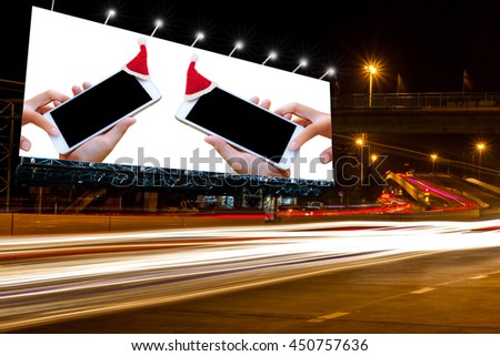 billboard blank for outdoor advertising poster at night time for advertisement street light . with Christmas decoration billboard.