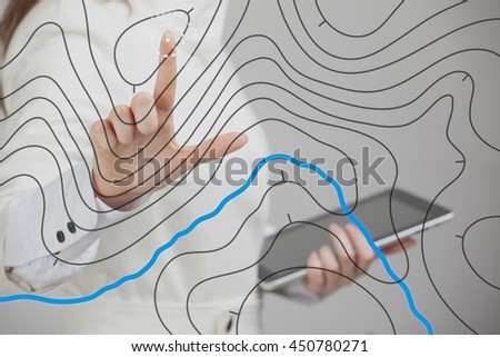 Geographic information systems concept, woman scientist working with futuristic GIS interface on a transparent screen. Royalty-Free Stock Photo #450780271