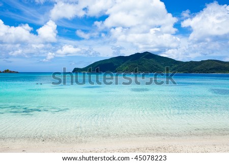 Deserted beach with clear blue water of Japanese islands