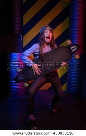 skater tomboy with skateboard at parking lot