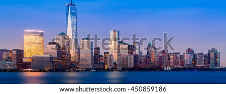 Skyline of lower Manhattan of New York City from Exchange Place at night with World Trade Center. Sized to fit a popular social media cover image placeholder