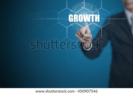 Businessman pressing button on touch screen interface and select Growth, Business concept.