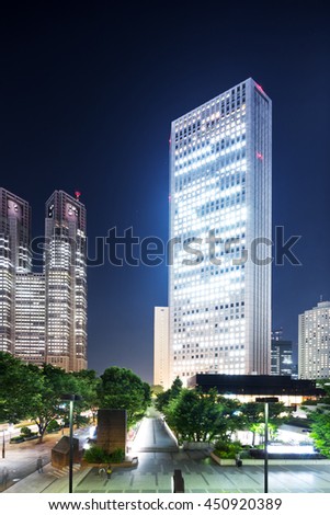 modern office buildings in downtown of tokyo at night on view from street