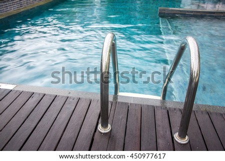 Grab bars ladder in the swimming pool.