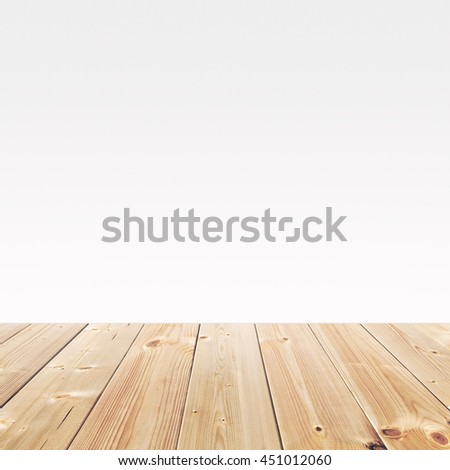 Empty wooden table for product placement or montage with focus to the table top in the foreground