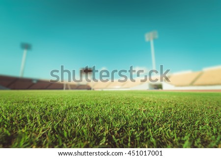 Green grass in soccer stadium.  Royalty-Free Stock Photo #451017001