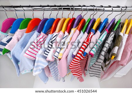 Clothes for kids in wardrobe