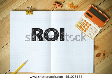 ROI text on paper in the office , business concept