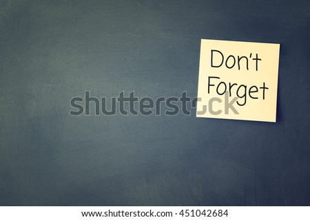 don't forget reminder, written on sticky memo attached to blackboard Royalty-Free Stock Photo #451042684