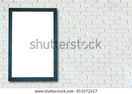 empty frame on the wall of white brick.