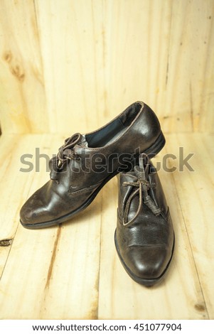 Leather shoes, men's fashion wooden background.
