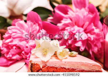 Food, food styling, cooking. Close up cake with beautiful white flowers and pink peony