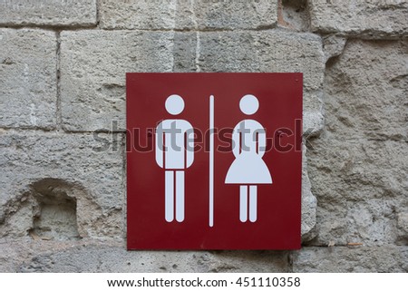 restroom signs with female and male symbol on old brick background. Sign of public toilets WC restroom 