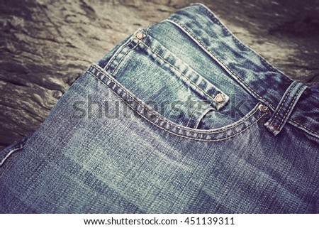 blue denim jean texture background - soft focus with vintage film filter
