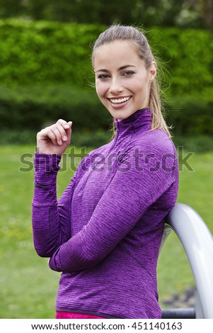 Smiling and beautiful athlete in purple top, portrait
