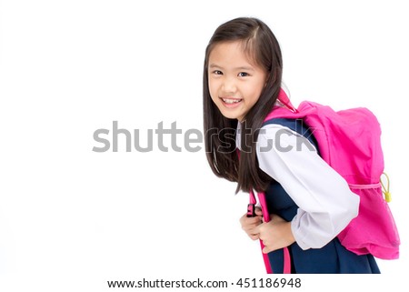 Portrait of Asian child in school uniform with school bag on white background isolated Royalty-Free Stock Photo #451186948