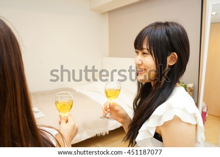 Young Japanese girls having a home party at home