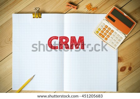 CRM text on paper in the office , business concept