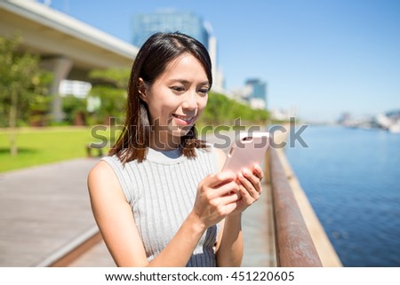 Woman using mobile phone at outdoor