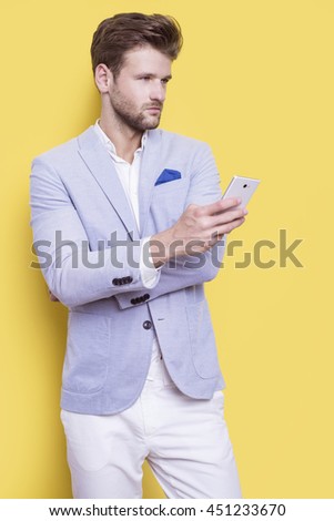 Handsome elegant man with a phone in his hand