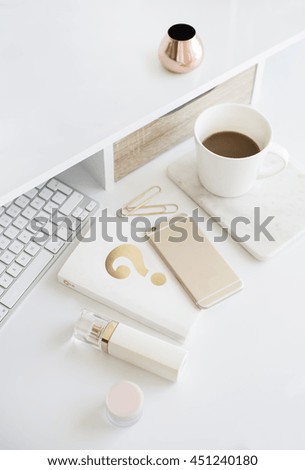 Desktop workplace top view. Modern trend template for advertising, product mock up. Presentation template. Coffee, keyboard, perfume, book, phone. White and gold. Minimalistic desk set.