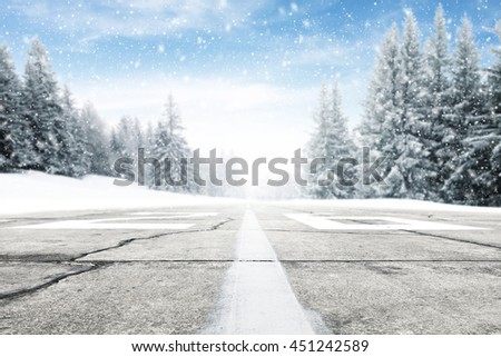 landscape of sky and trees of snow and street 