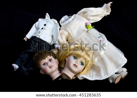 Girl and Boy Doll broken wedding body on black background