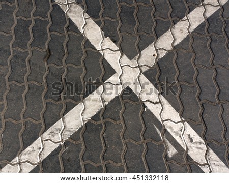 White traffic sign on gray pavement. Signs and symbols background.