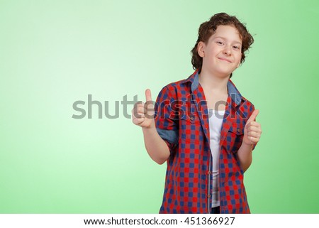 Little boy giving the thumbs-up sign