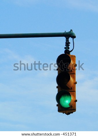 Green Traffic Light and Blue Sky