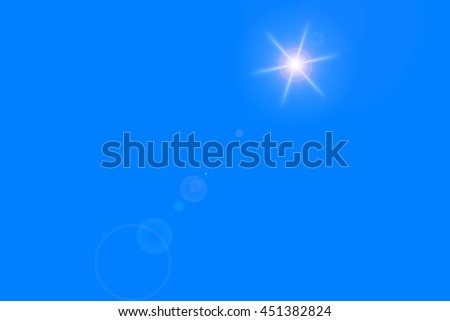 blue background with light shining star, sun's rays
