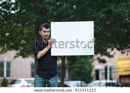 man with a white board on hands, male student poster