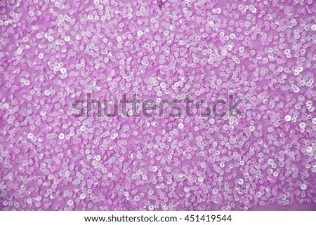 Fabric sequins in bright colors. Fashion fabric with glitter, sequins. Background sequin. BEADS factories, glitter surfactant. Holiday abstract glitter background with blinking lights. 
  