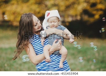 creative  young mother poses for photographer