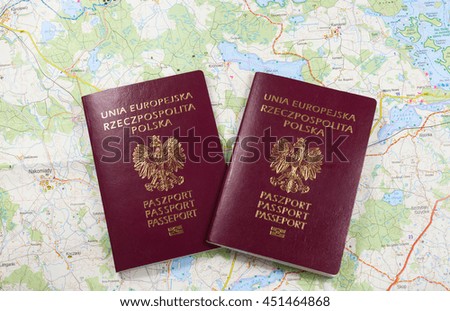 Map and two passports ready to be used. Color photo.